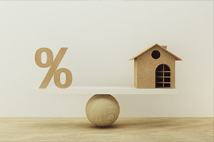 Percentage symbol icon and house scale in equal position.