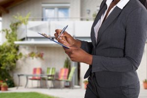 Woman conducting a home appraisal