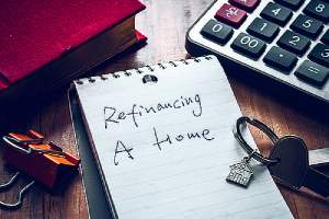 Refinancing a home written on a notepad
