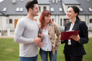 realtor explains private mortgage insurance to couple after showing them the house