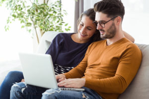 homebuyers use laptop to find more information on a title company