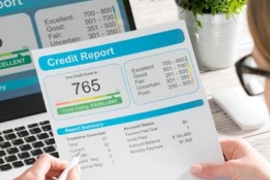 Person Looking at Credit Report after knowing mechanic’s lien