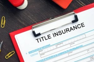title insurance on paper with red cardboard