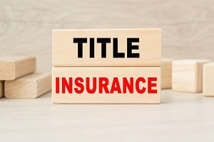 title insurance is written on a wooden cubes structure