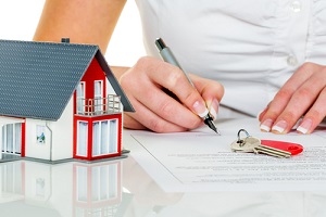woman signs a contract to purchase a home with a real estate agent knowing What Does Title Insurance Not Cover