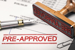 a mortgage application with a red pre approved stamp on it