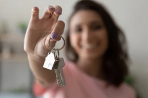 women holding home keys