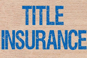 title insurance on wooden block