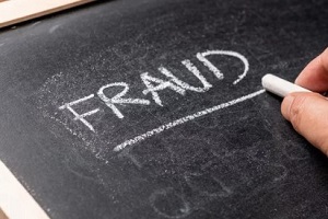 writing fraud with white chalk