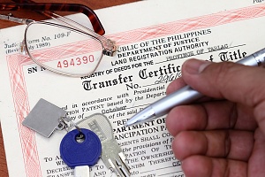 man signing a home title certificate